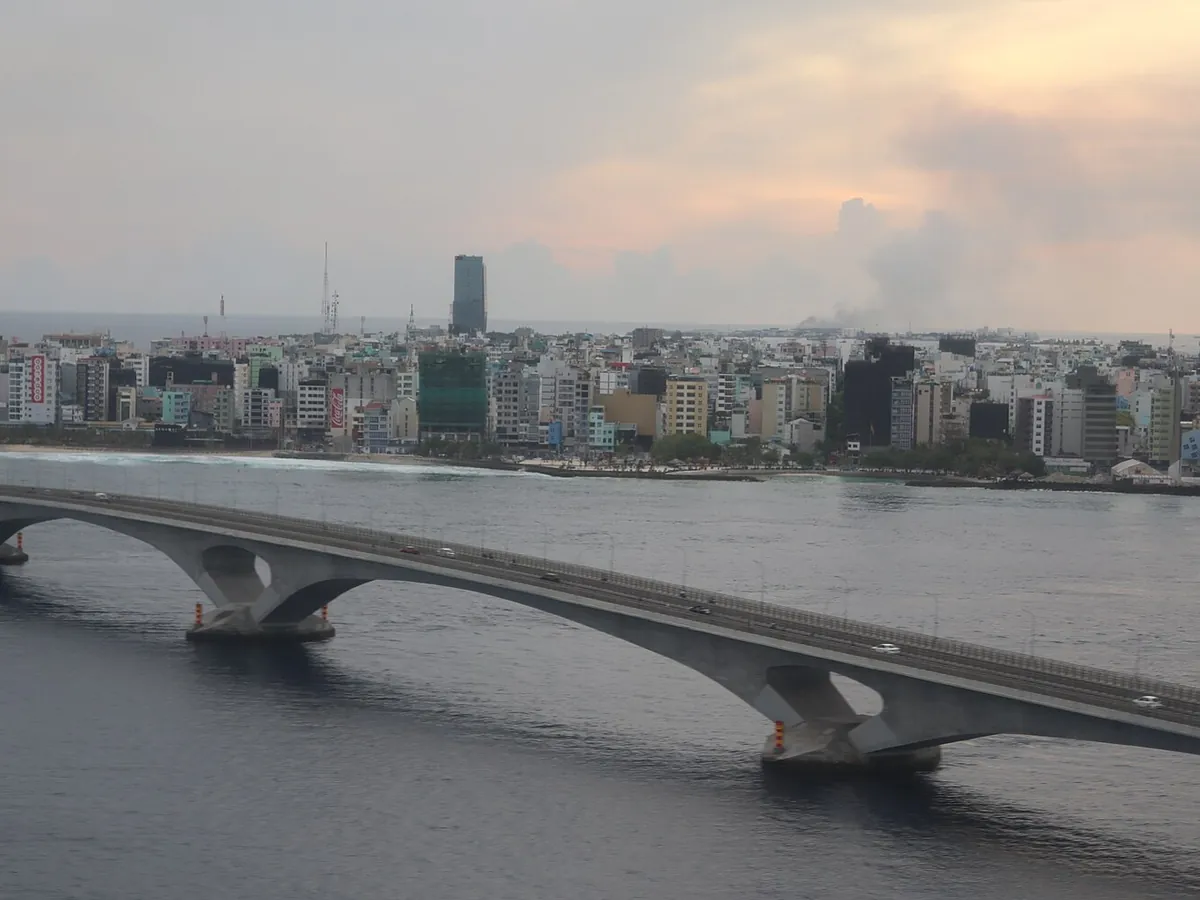 Sinamalé Bridge crossing the sea toward the Malé city skyline